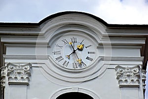 Church tower closep with large clock and golden hands. photo