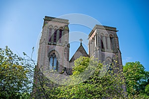 Church Tower of Inverness Cathedral with trees in front, low angle view, Scotland