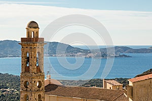 Church tower of Lumio with Calvi in background