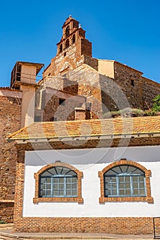 Church tower and old buildings in the closed mine of Almacen, Ciudad Real, Spain. photo