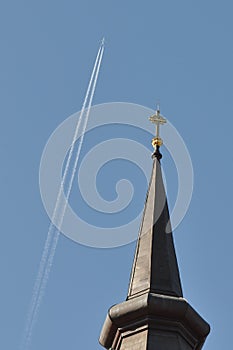 Church tower and plane