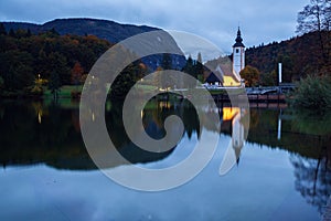 Church tower and stone bridge at Lake Bohinj