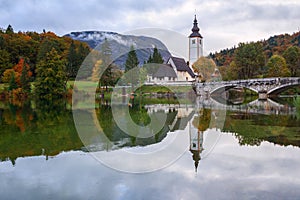 Church tower and stone bridge at Lake Bohinj