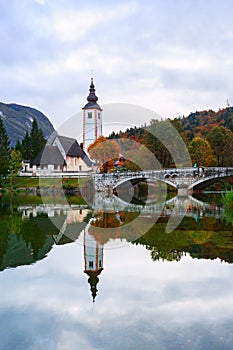 Church tower and stone bridge at Lake Bohinj