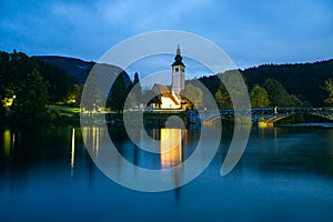 Church tower and stone bridge at Lake Bohinj