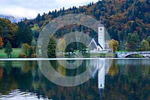 Church tower and stone bridge at Lake Bohinj