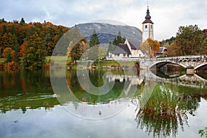Church tower and stone bridge at Lake Bohinj