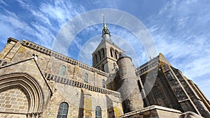 church and tower at the top of Mont Saint Michel in France. Old stone architecture