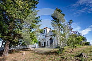 Church among  trees at summer time, in figueiro dos vinhos, portugal photo