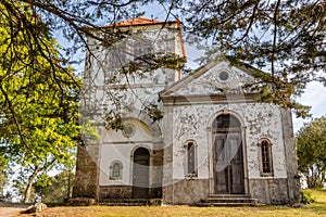 Church among  trees at summer time, in figueiro dos vinhos, portugal photo