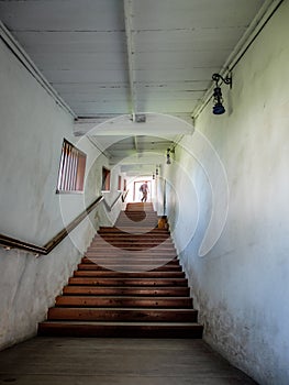 Church tunnel with stairs leading to garden