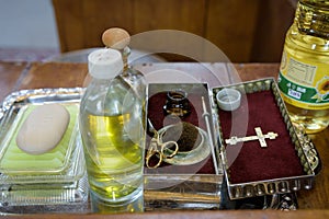 Church utensils at the altar, glans,ceremony of water baptism, various objects needed for baptism christening - oil, soap, scissor