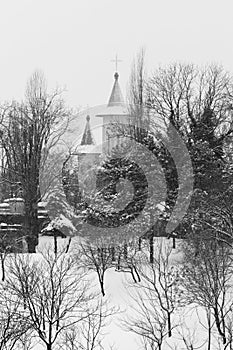 Church and graveyard in a winter day