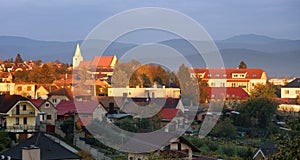 Church in village Senkvice with mountain background at dramatic