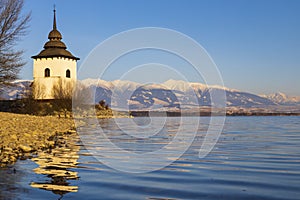 Church of Virgin Mary in Havranok and lake Liptovska Mara, district Liptovsky Mikulas, Slovakia