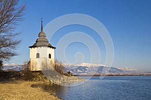 Church of Virgin Mary in Havranok and lake Liptovska Mara, district Liptovsky Mikulas, Slovakia