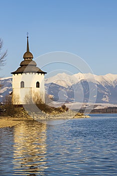 Church of Virgin Mary in Havranok and lake Liptovska Mara, district Liptovsky Mikulas, Slovakia