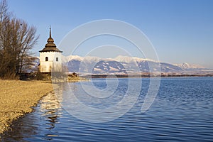 Church of Virgin Mary in Havranok and lake Liptovska Mara, district Liptovsky Mikulas, Slovakia