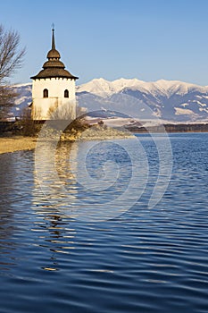 Church of Virgin Mary in Havranok and lake Liptovska Mara, district Liptovsky Mikulas, Slovakia