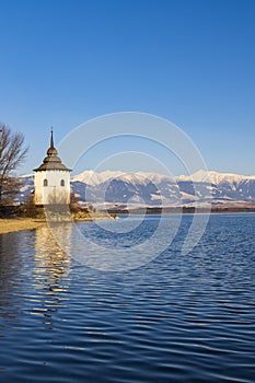 Church of Virgin Mary in Havranok and lake Liptovska Mara, district Liptovsky Mikulas, Slovakia