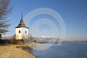 Church of Virgin Mary in Havranok and lake Liptovska Mara, district Liptovsky Mikulas, Slovakia