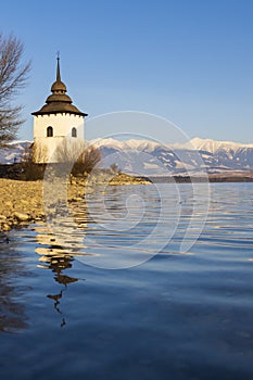 Church of Virgin Mary in Havranok and lake Liptovska Mara, district Liptovsky Mikulas, Slovakia