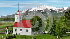 Church and white mountains in the background