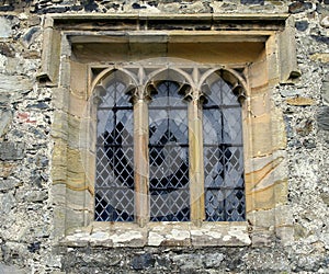 Church window, stone, mullioned, ancient. photo