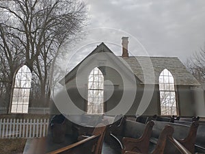 Church Windows and Seats in a House Reflection