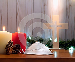 Church with wood cross, face mask and bible on Christmas. Social distance. Re-opening of Church.