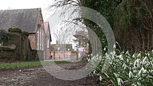 Church yard in England with snow drops