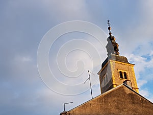 Churche tower iluminate with sun photo
