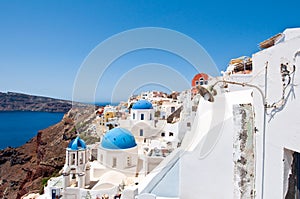 Churches with blue domes on the edge of the caldera on the island of Santorini, Greece.