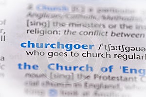 Churchgoer word in a dictionary. Selective focus, close up