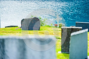 Churchyard in Nes village at fjord, Norway