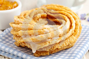 Churro donuts and bowl of honey