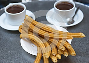 Churros with chocolate photo