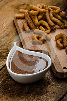 Churros with chocolate dip - Streed food, deep fried photo