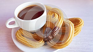 Churros con chocolate caliente, a traditional Spanish street food photo