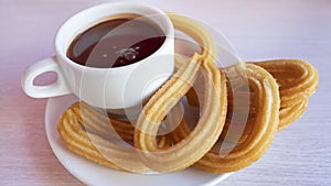 Churros con chocolate caliente, a traditional Spanish street food photo