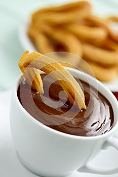 Churros con chocolate, a typical Spanish sweet snack photo