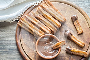 Churros - famous Spanish dessert with chocolate sauce