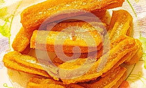 Churros on a plate for snack or breakfast typical of Spain