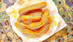 Churros on a plate for snack or breakfast typical of Spain