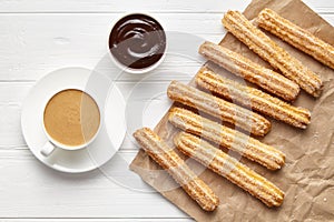 Churros traditional Spain street fast food baked sweet dough snack with chocolate and coffee