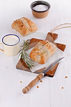 Ciabatta bread over rustic white wooden background