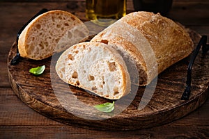 Ciabatta Bread on the wood tabled. Freshly baked traditional bread on wooden table.