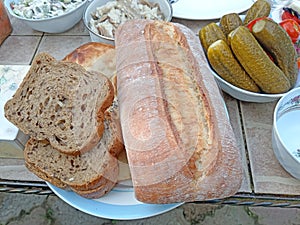 Ciabatta and other kinds of bread on table