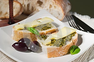 Ciabatta, pesto with cheese and olives