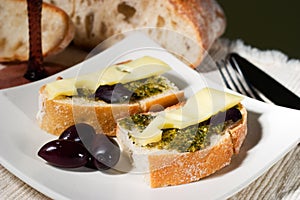 Ciabatta, pesto with cheese and olives